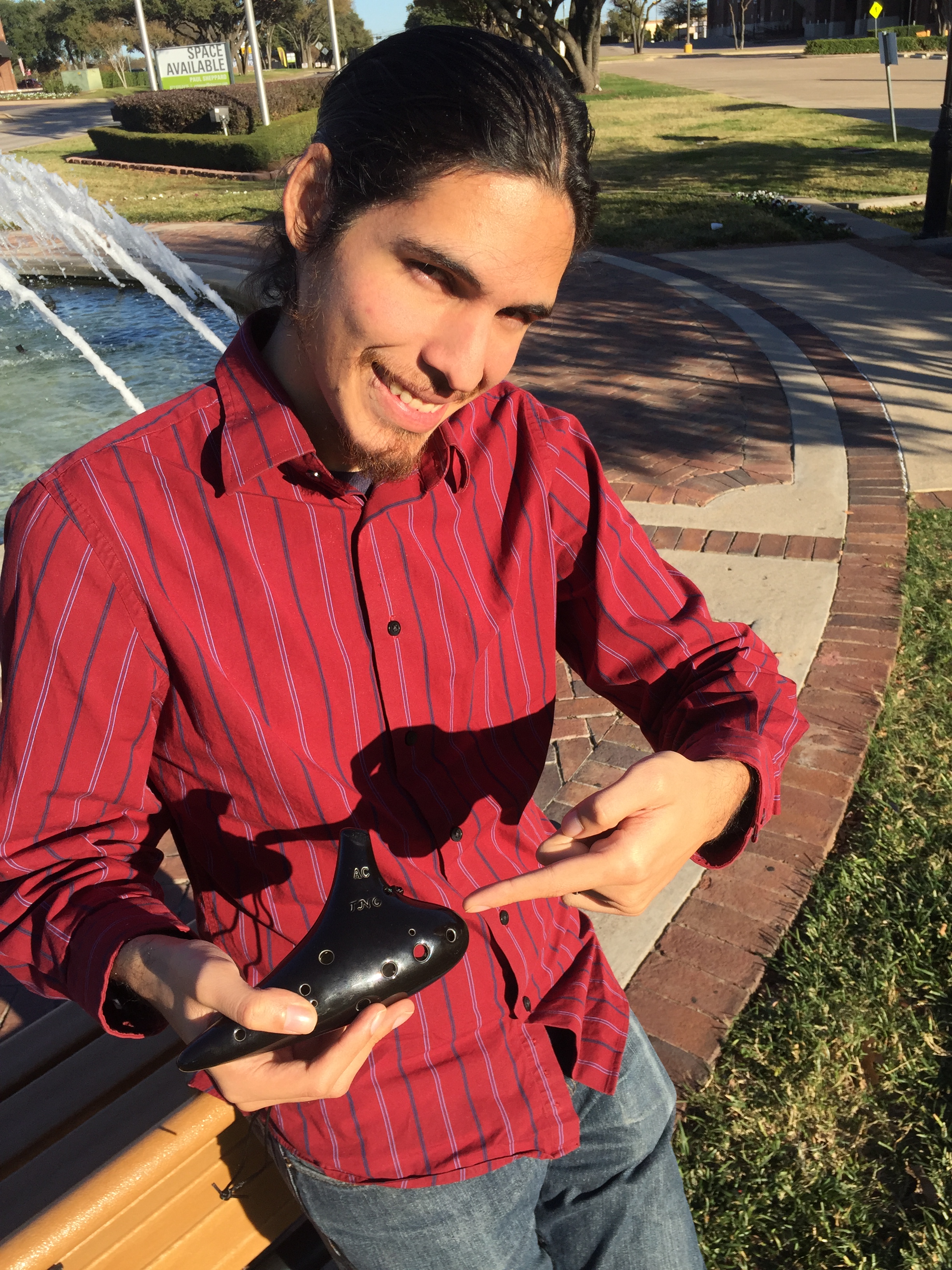 Ocarina Owl holding a 12-hole ocarina